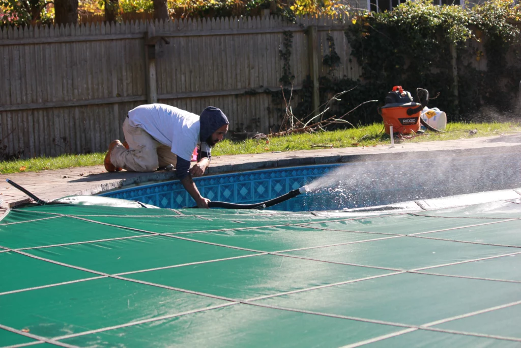 Romanelli Pools Technician Working on Safety Cover installation