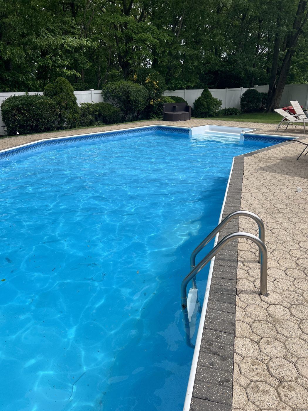 After: the same pool, crystal clear and blue