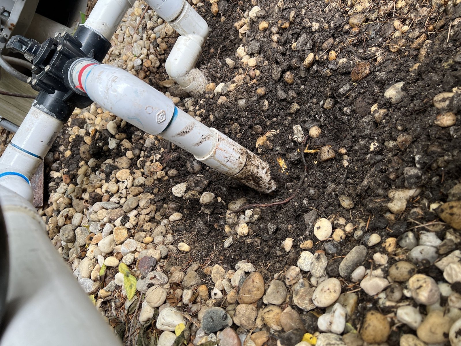 Pool valve on the equipment pad next to a pipe that split in a freeze